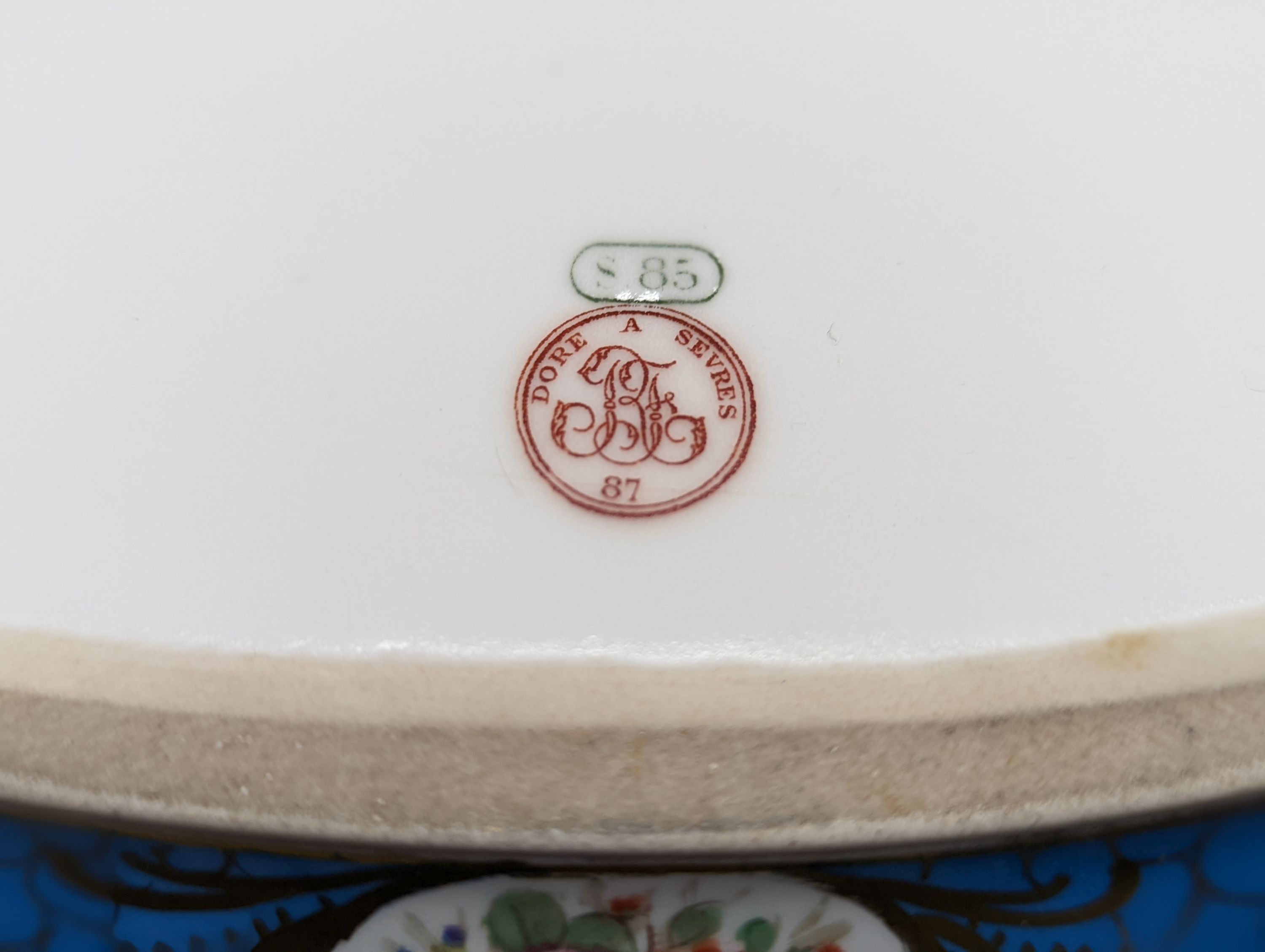 A Sevres style boat shaped dish and a Limoges circular dish, Sevres dish 27 cms wide & Limoges dish 31 cms diameter.